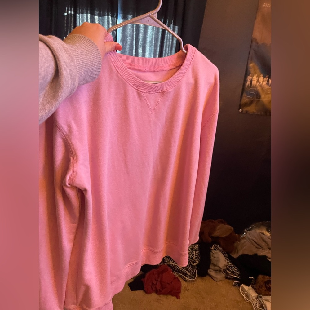A pink sweatshirt.